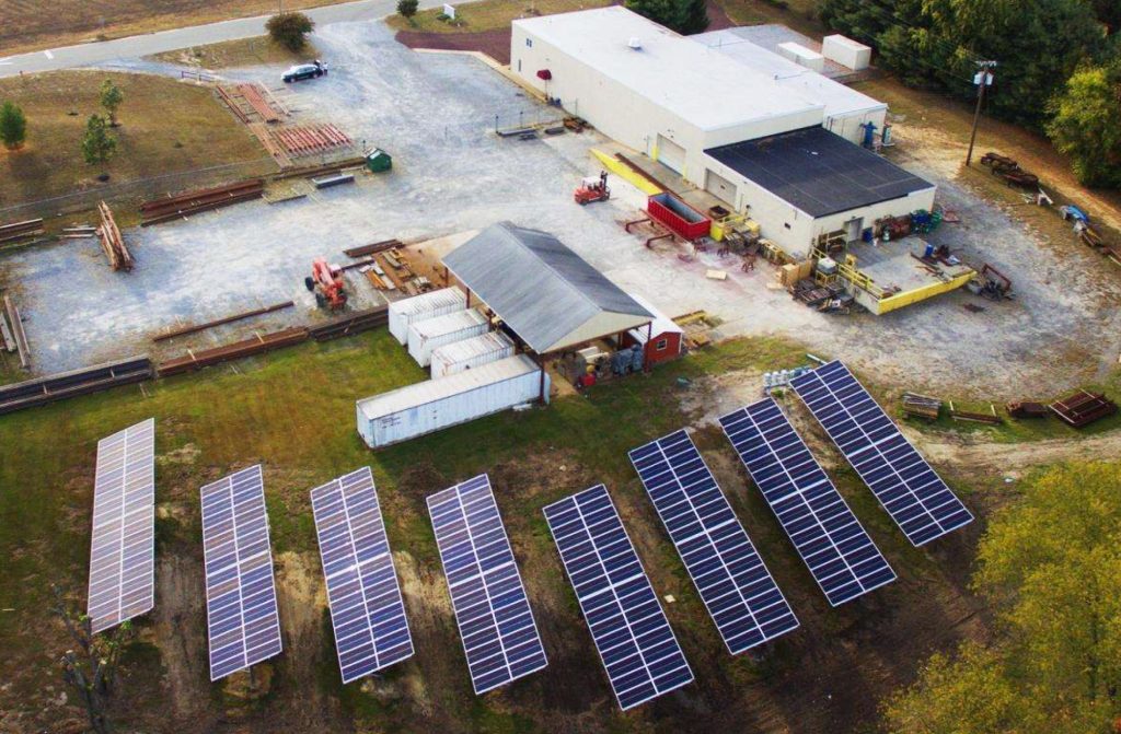 Aerial view of CMI-Promex solar array and primary building.